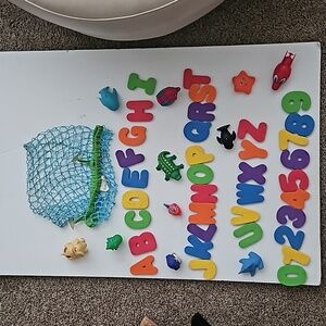 Various bath toys with suction cup bag